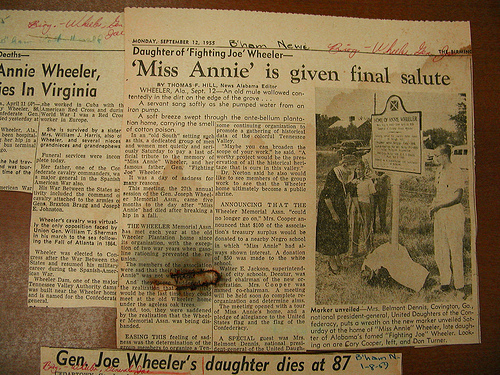 Newspaper clippings shelftop.